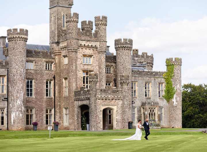 Couple walking in front of the castle